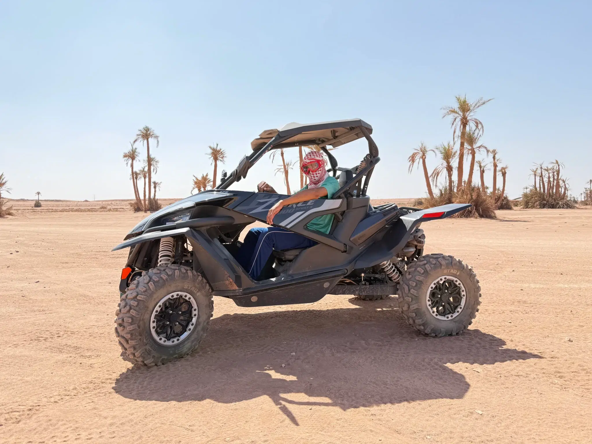 Buggy 1000cc driving over sand dunes in Marrakech Palmeraie desert